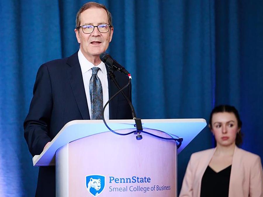 Smeal dean Charles H. Whiteman speaks at a podium