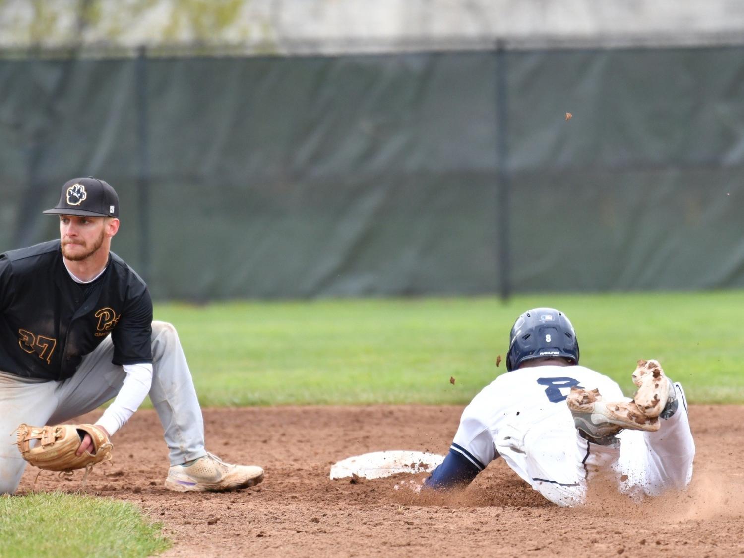 A Penn State Behrend baserunner slides toward a base.