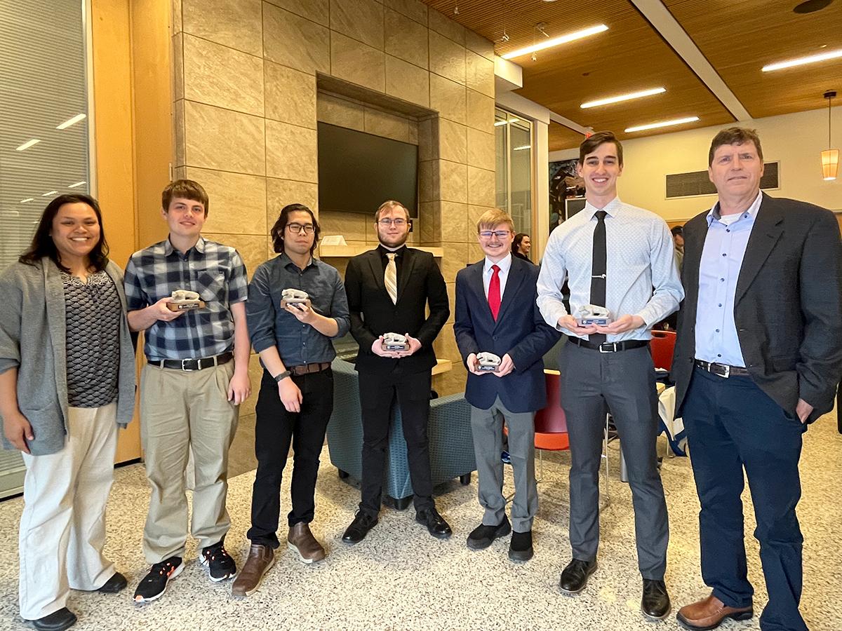 Jennilyn Vallejera, ELD program coordinator, Brant Kensinger, Thanatat Thanaravisara, Jacob Dicken, Matthew Mackereth, Jared Kish, Todd Batzel, interim division head, Business, Engineering, and Information Sciences and Technology. Missing from photo: Nathanial Moore.