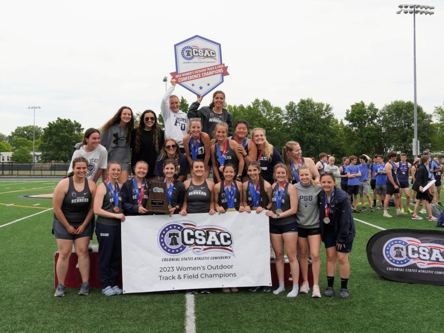 The Penn State Behrend women's track and field team celebrates its CSAC championship win.
