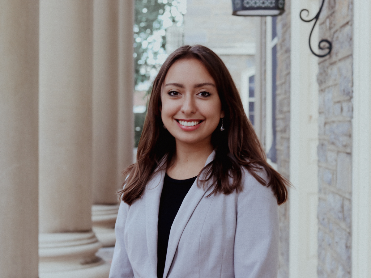 Head shot of Isabella Briseño dressed in a dark shirt and light blazer