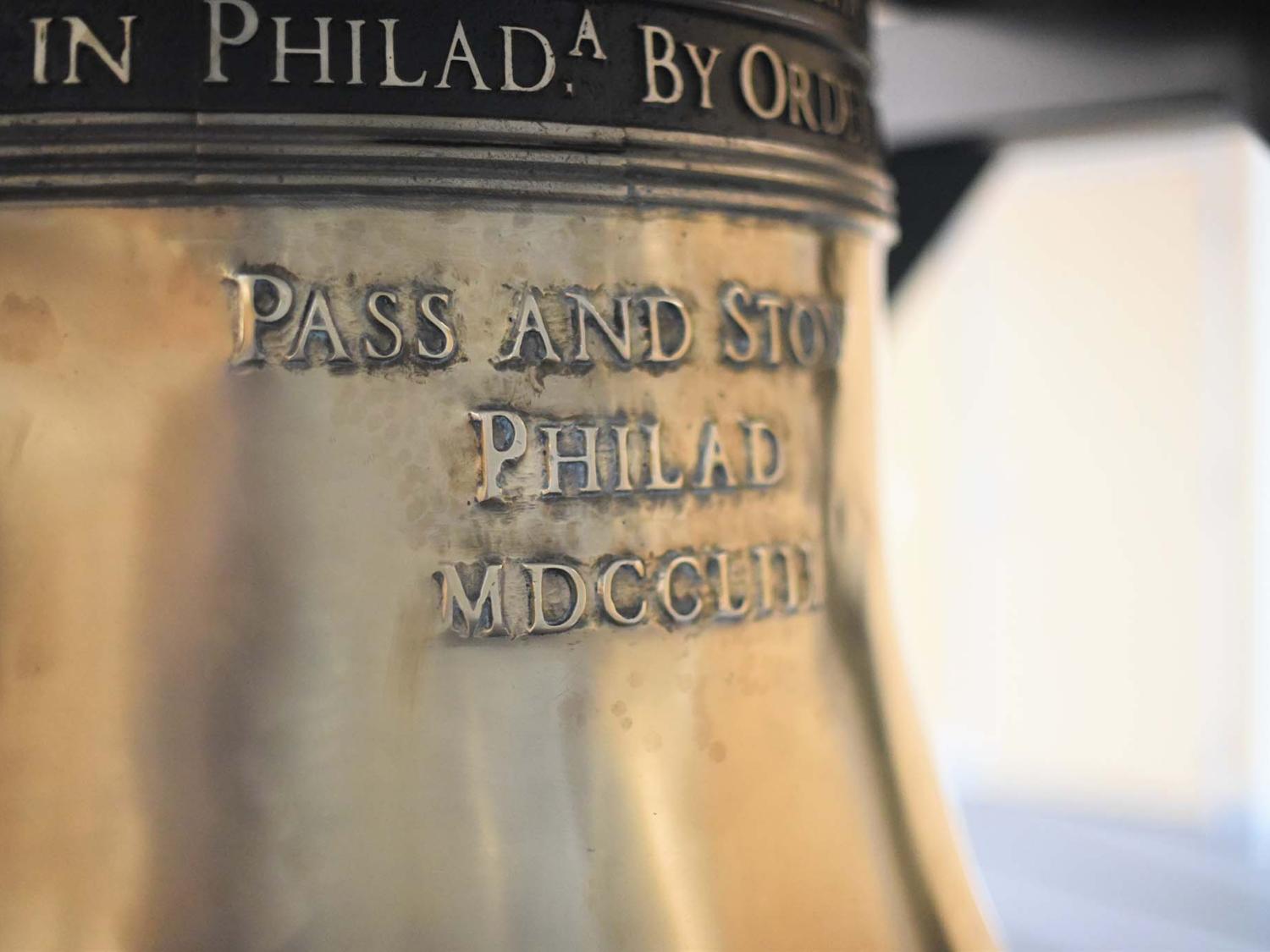 A close-up of a replica of the Liberty Bell