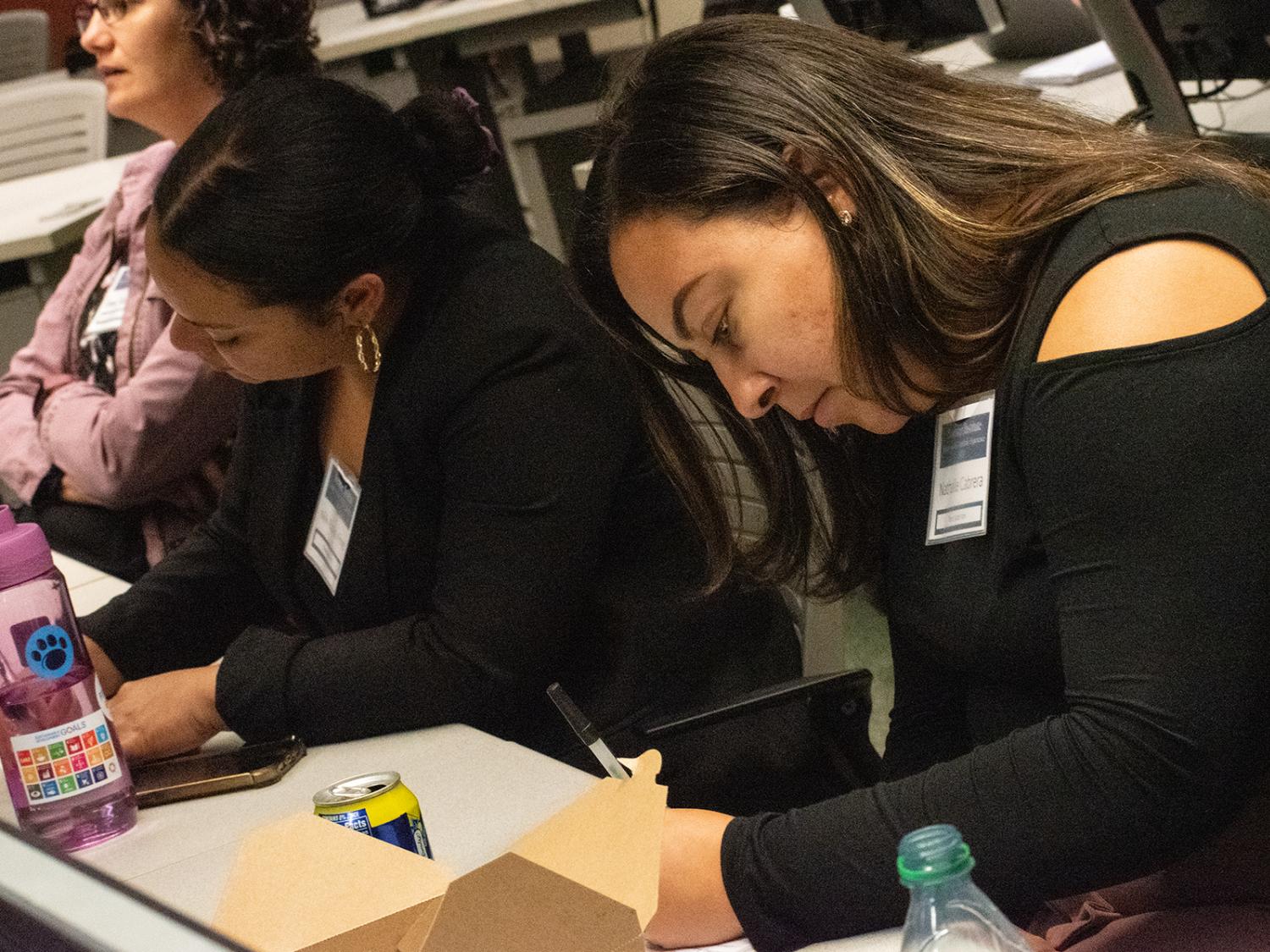 People collaborating on a project at a table