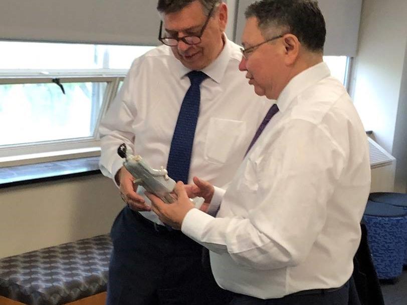 Two men shaking hands in an office