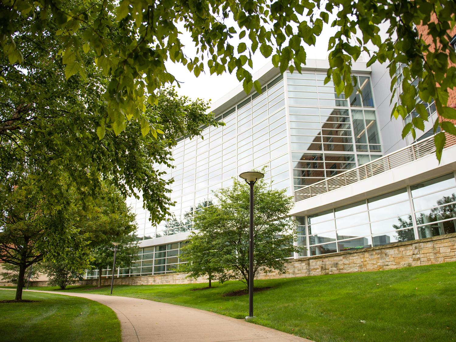 A photo of the front of the Business Building in the summer.