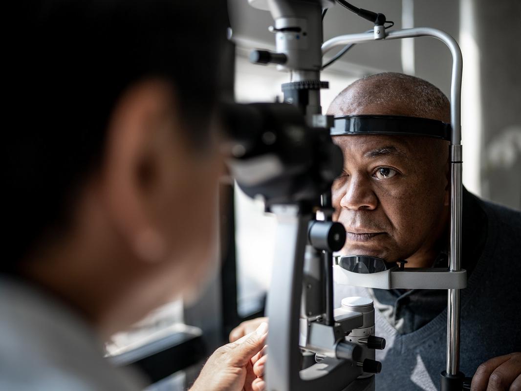 An ophthalmologist examines a patient’s eyes.