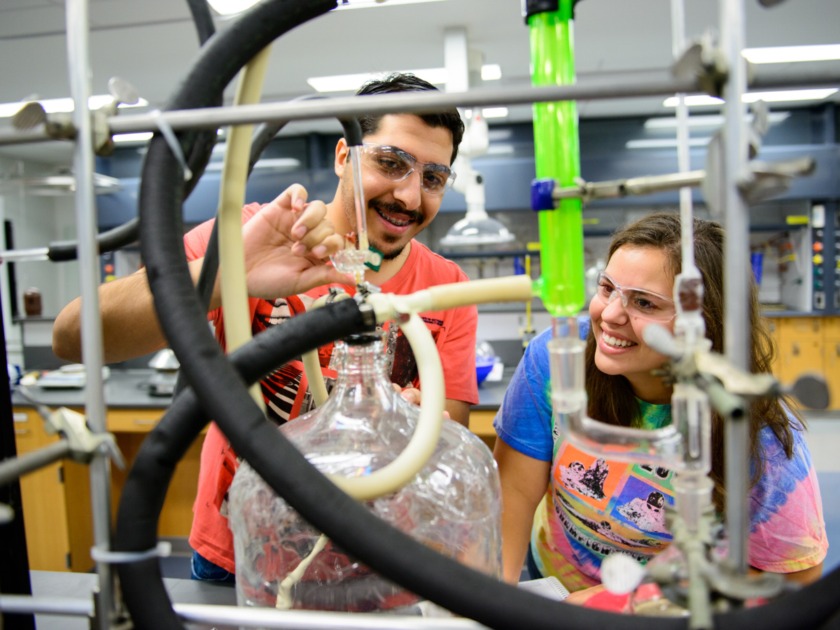 Researchers at Penn State lab working with tubes