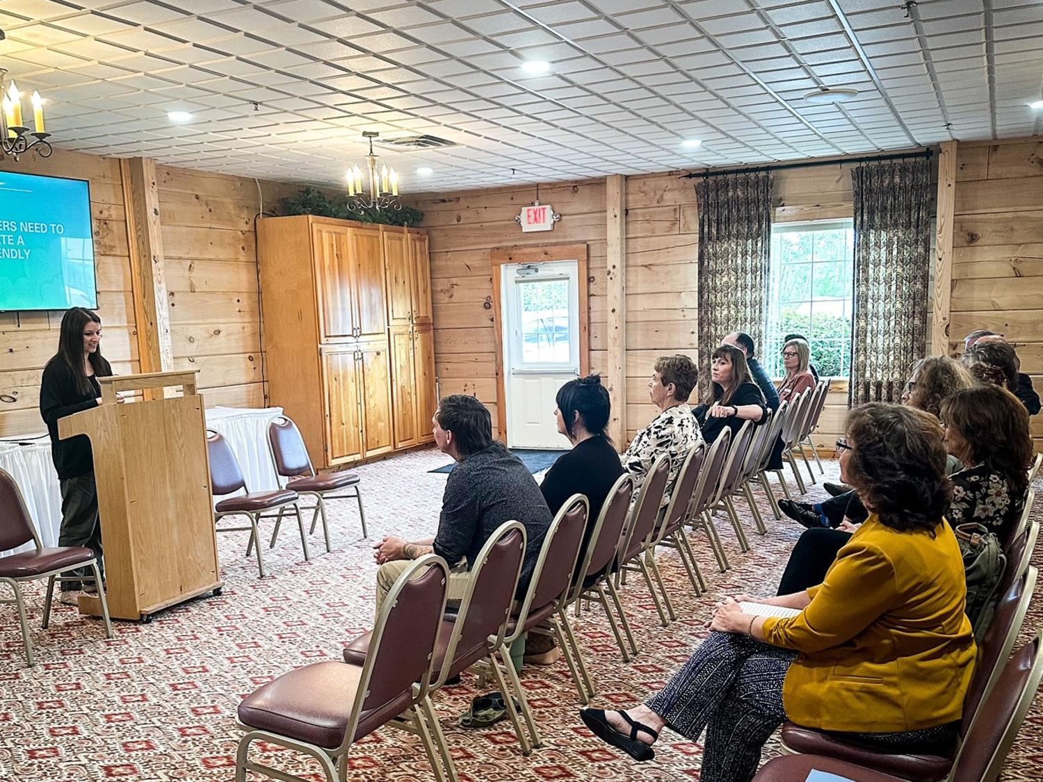 Jessica Clontz, at podium, giving her featured presentation at the recent Recovery Expo and Hiring Event.