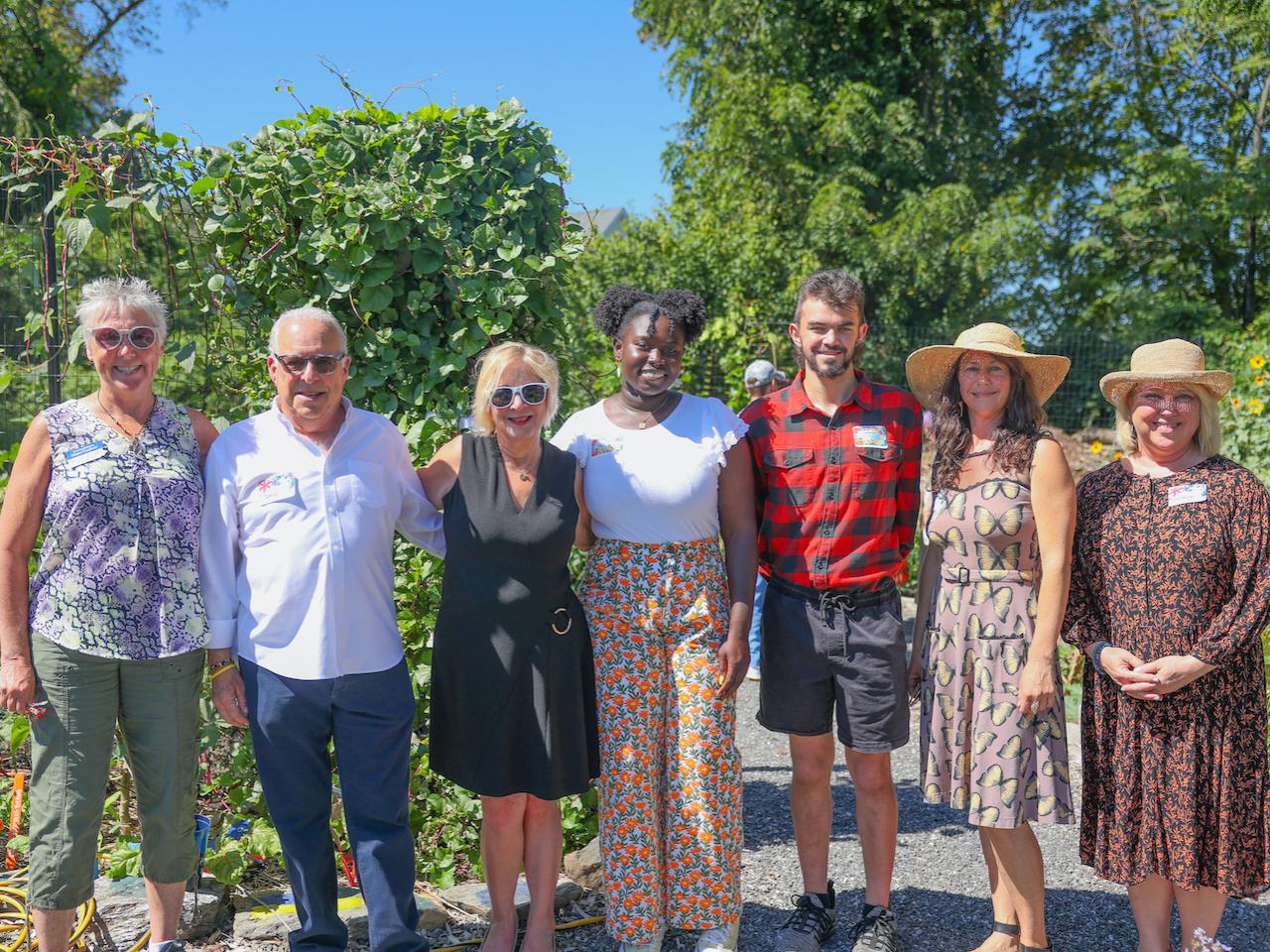 group of people smiling in garden