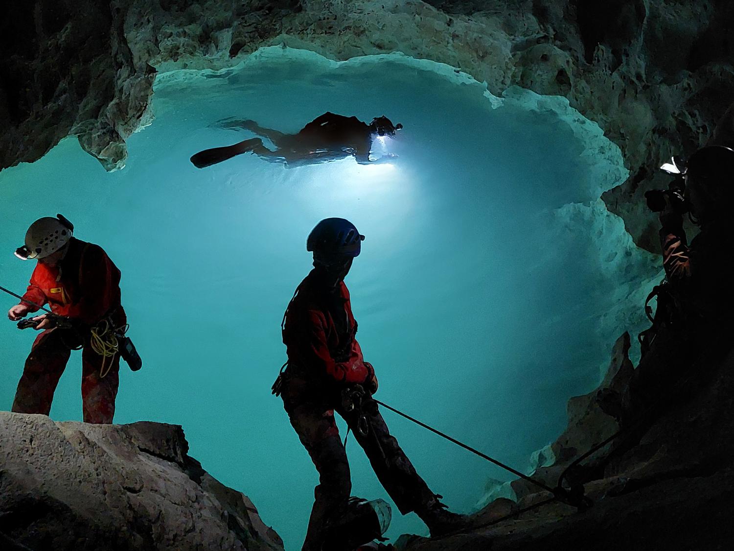 Divers in an underground lake