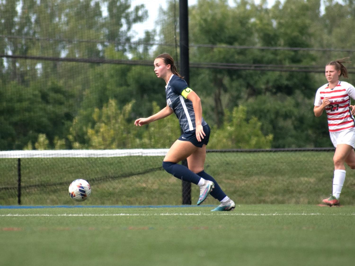 A Penn State Behrend women's soccer play prepares to kick the ball.