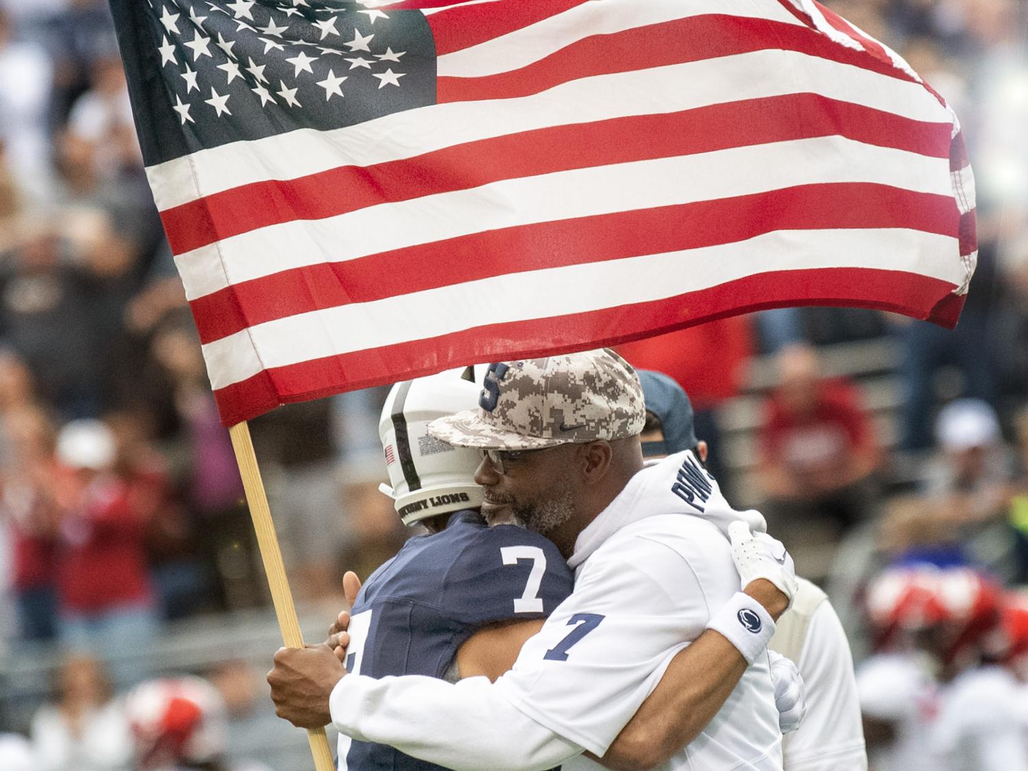 Saunders gives flag to dad