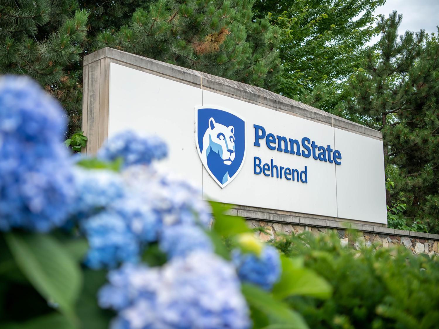 Flowers in front of the Penn State Behrend entrance sign