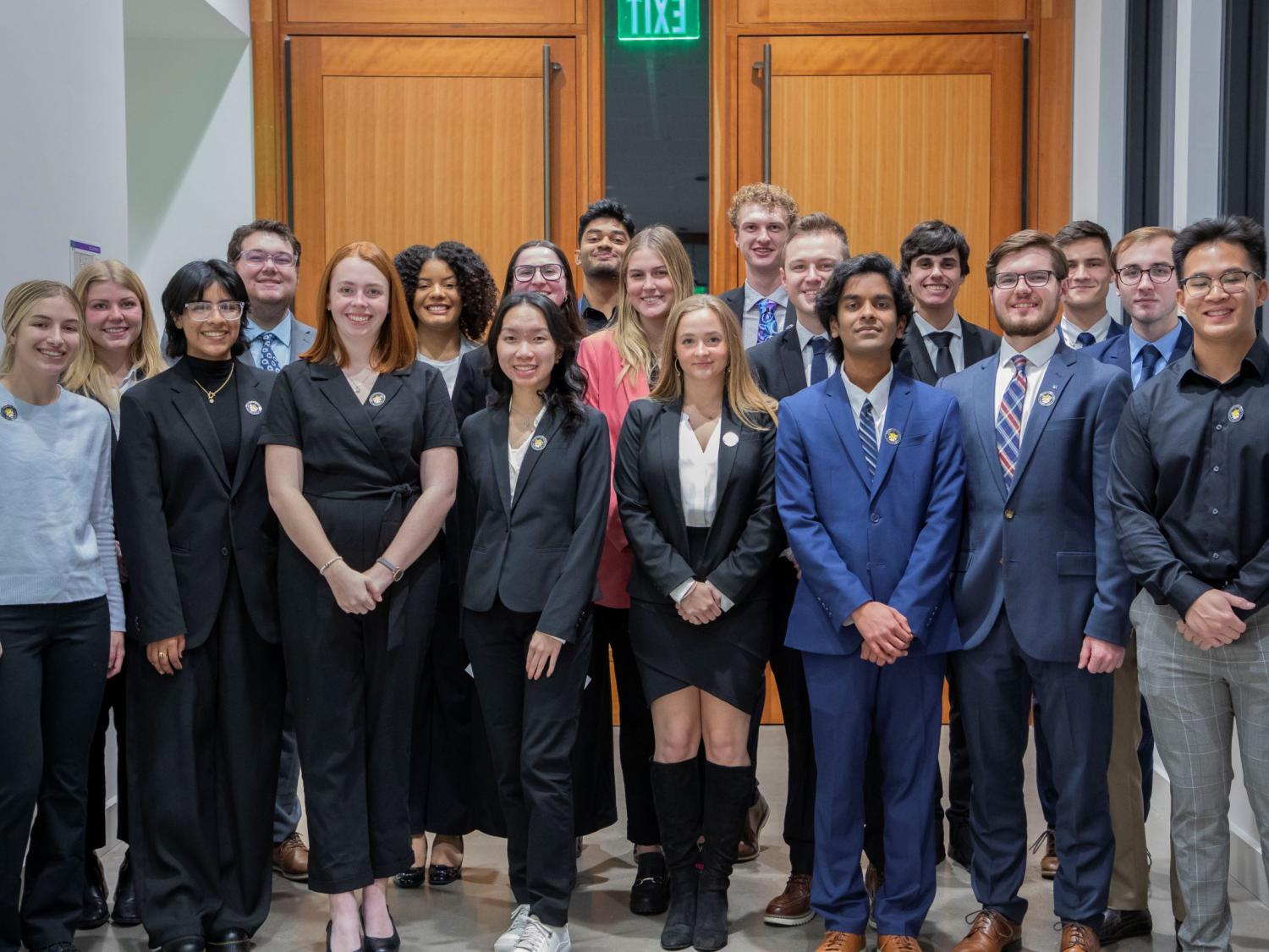 group of 19 college students in business attire