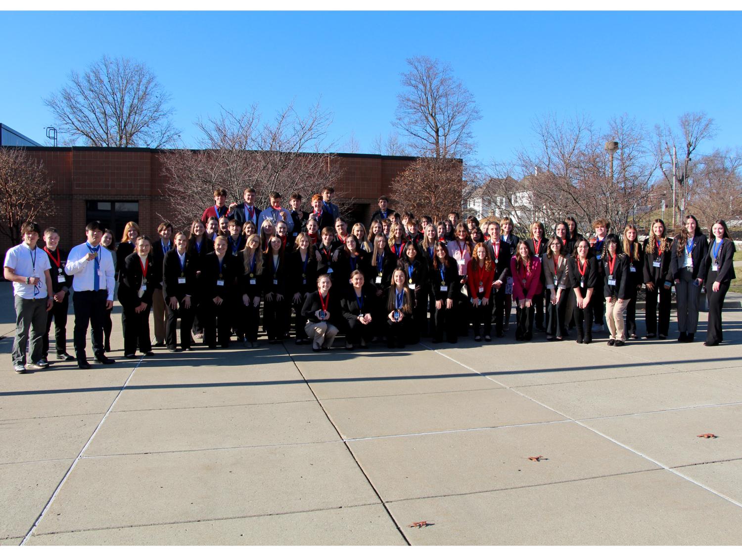 Medal winners from the 2023 Pennsylvania DECA District 1 conference gather at the Schoch Plaza, on the Penn State DuBois campus, following the awards ceremony.