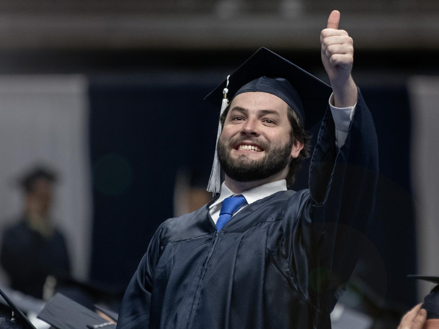 happy graduate thumbs up