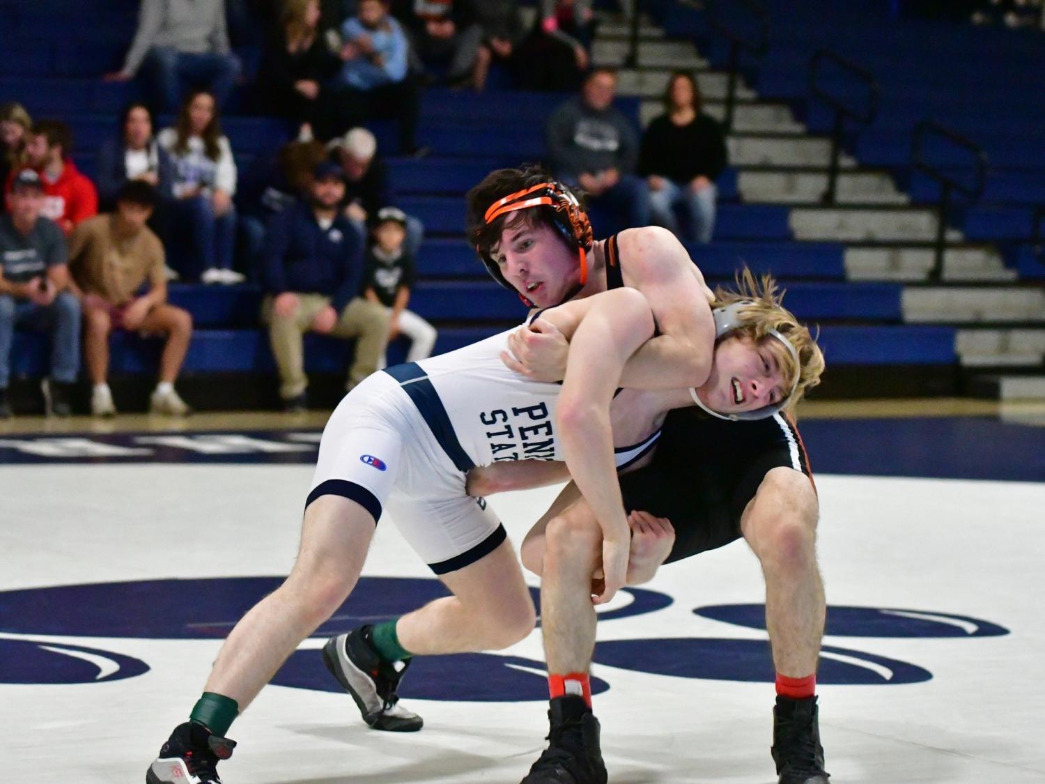 Two wrestlers grapple during a meet at Penn State Behrend.