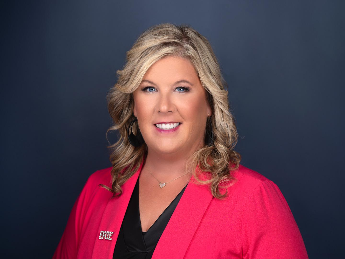 A portrait of Ainslie Brosig, executive director of the ExpERIEnce Children's Museum