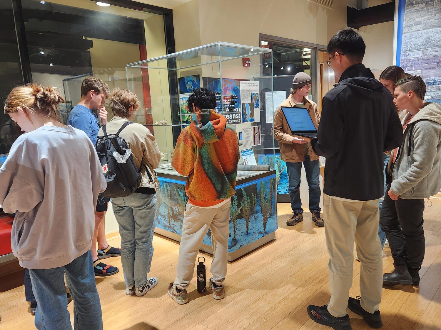 Students tour the EMS museum exhibit titled "Cretaceous Oceans and Climate."