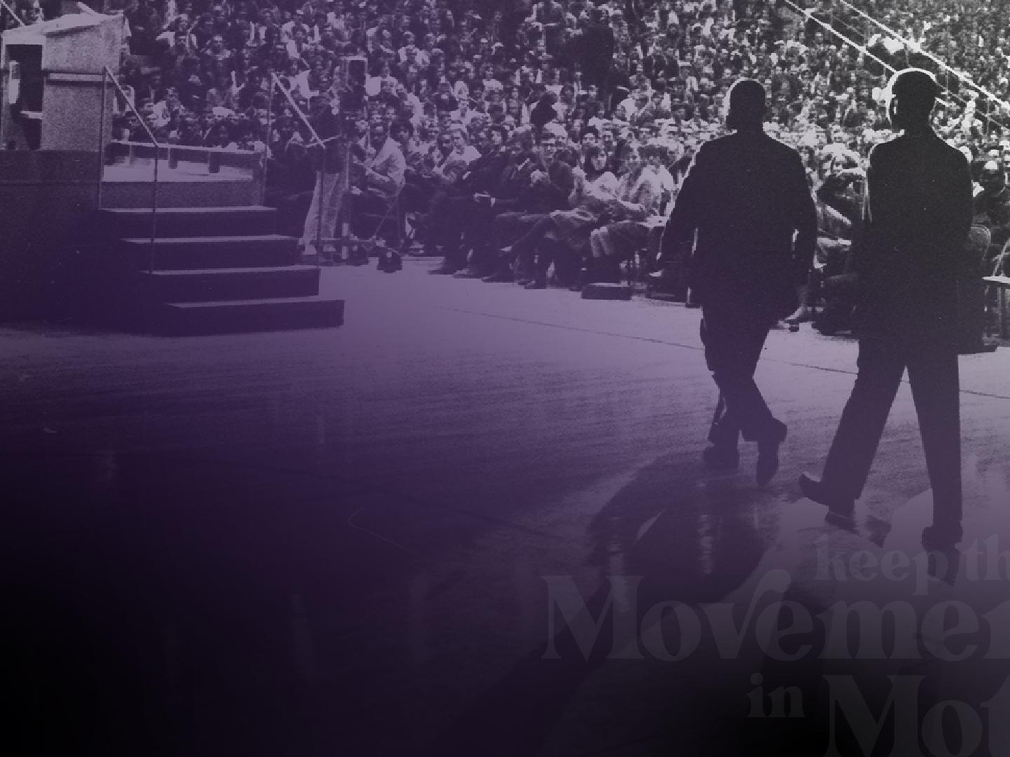 Martin Luther King Jr. walks across the Rec Hall stage at Penn State