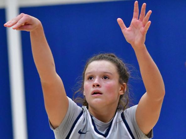 Penn State Behrend basketball player Morgan Altavilla holds her hands up after taking a shot.