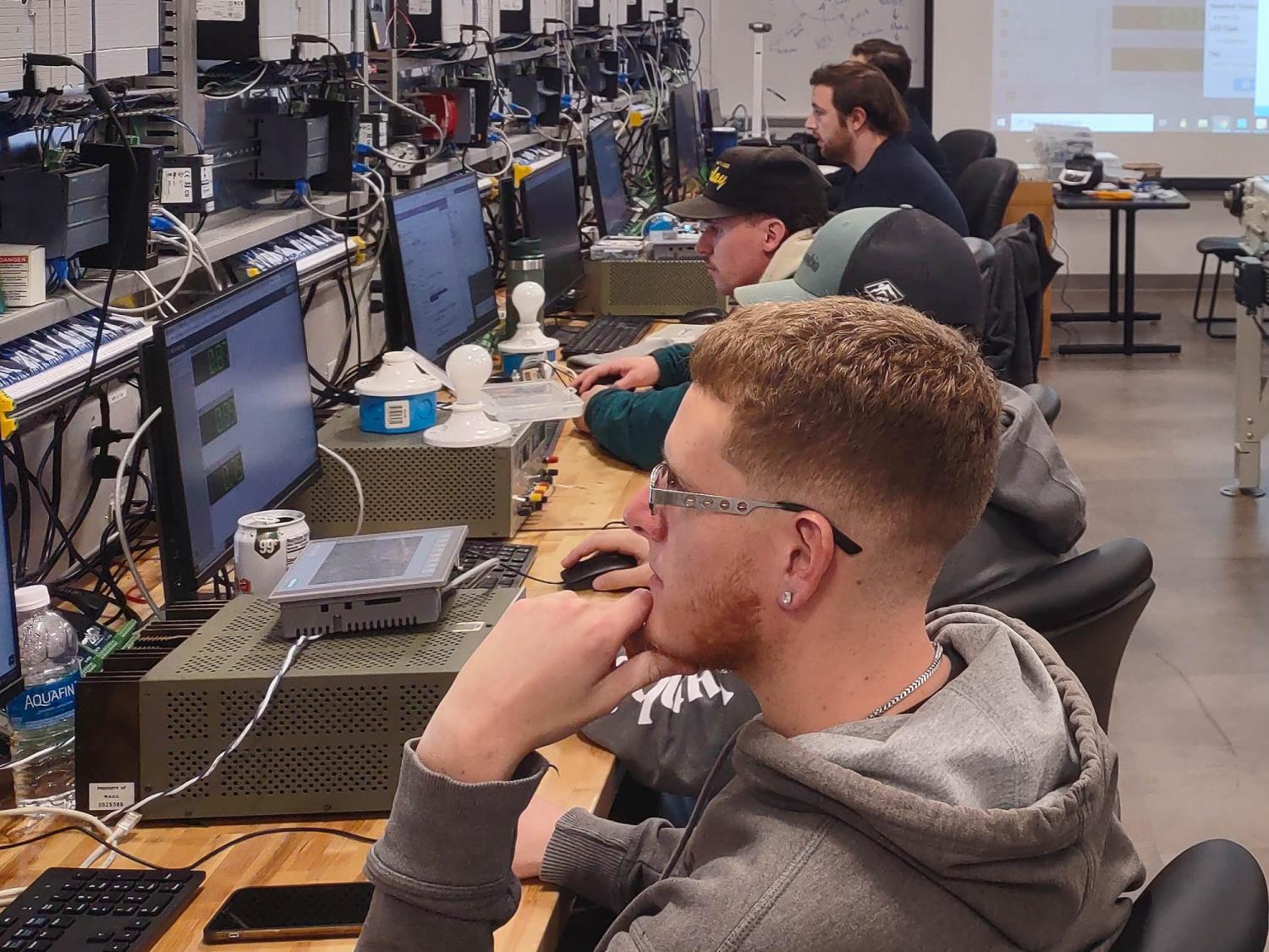 Student in a lab working on automation software.