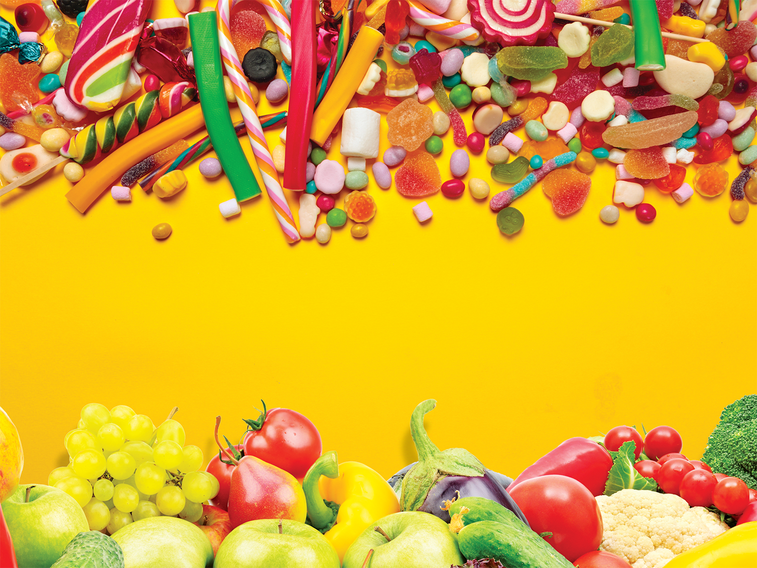 A yellow background with candy at the top and fruits and vegetables at the bottom.