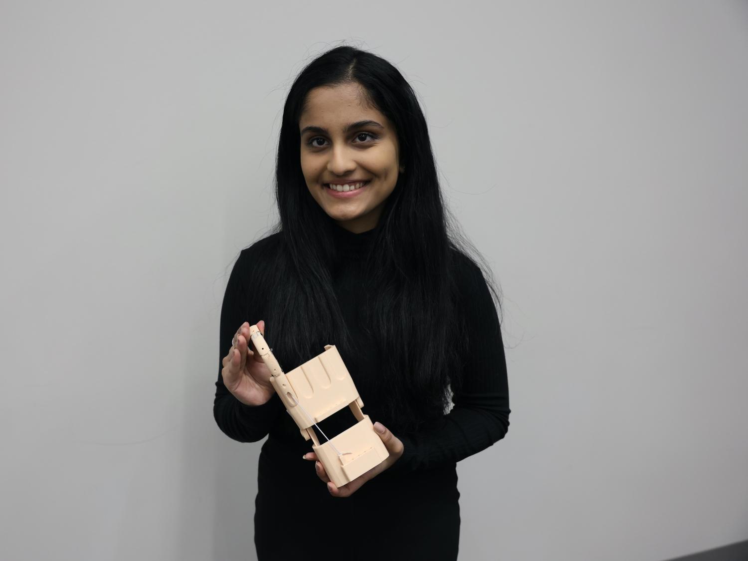 pratima oulkar holding prosthetic hand