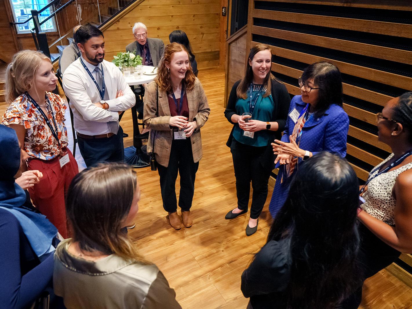 Dean Karen Kim talks with scholarship recipients at the Alumni and Scholars Celebration during the College of Medicine’s Alumni Weekend on Friday, Sept. 29, 2023.