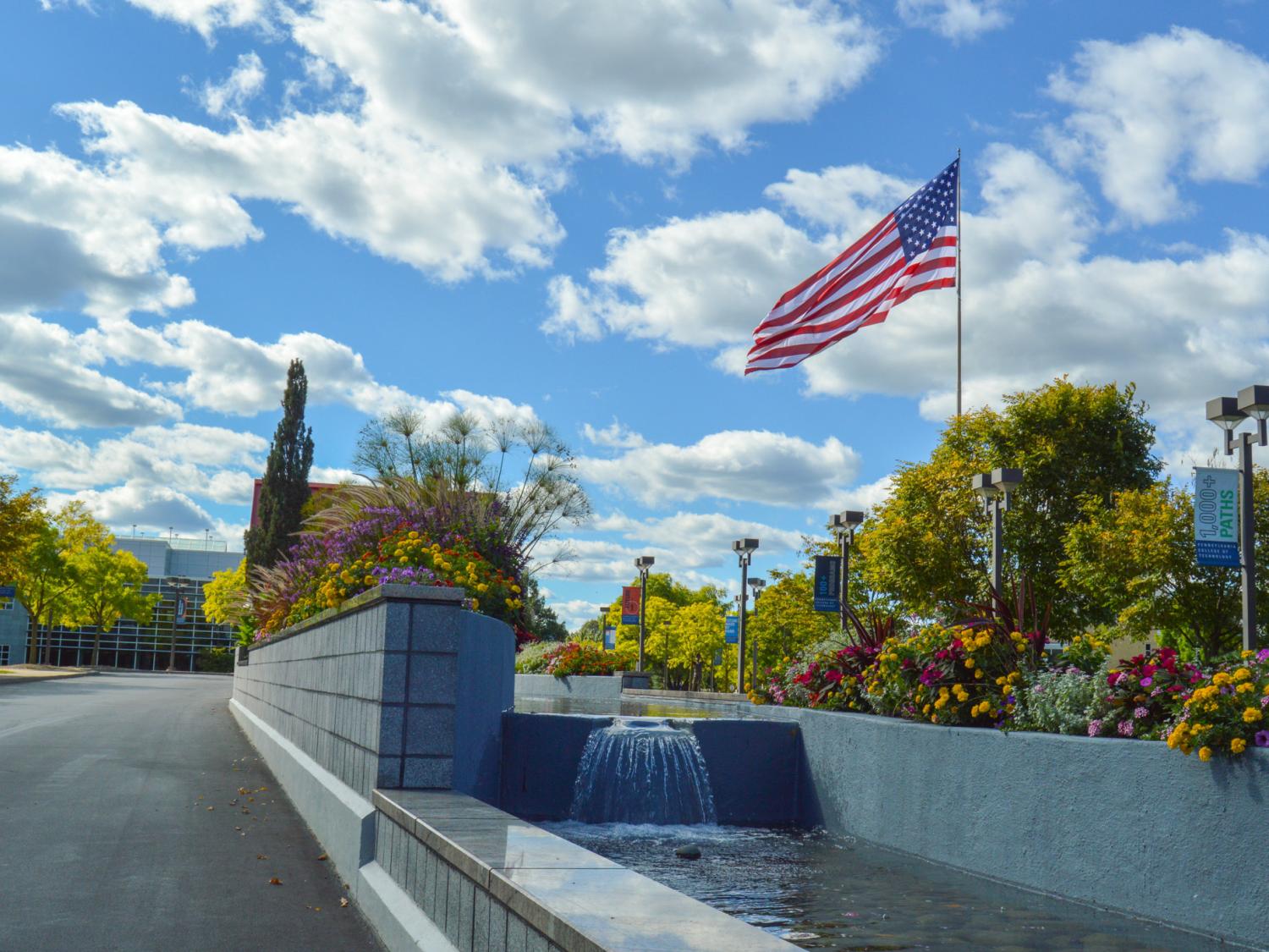 The American flag flies above the entrance to Penn College