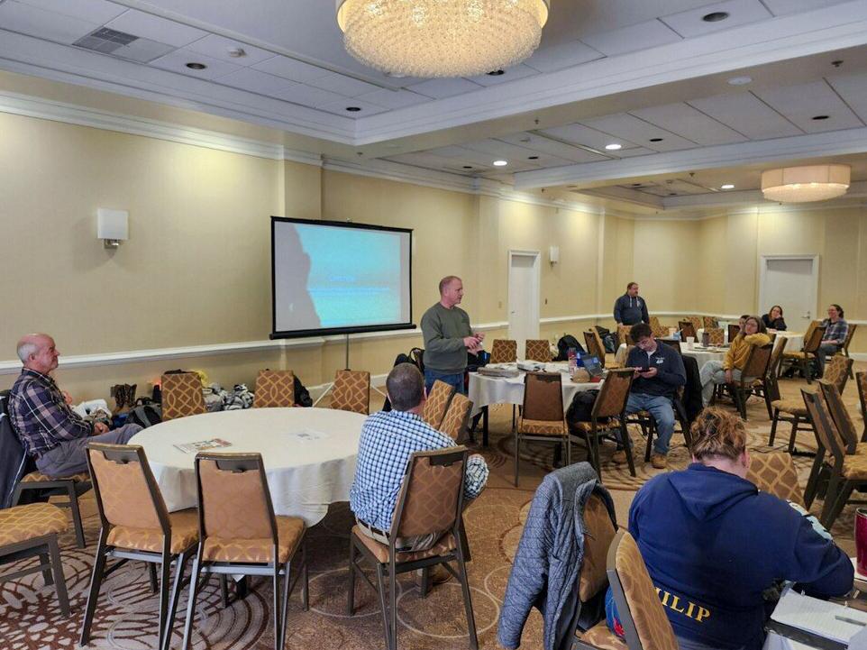 A room full of attendees to a workshop