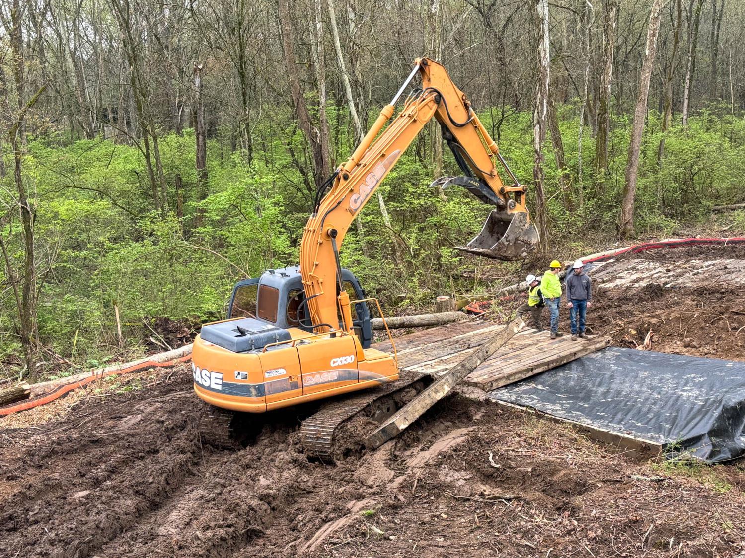 A big piece of machinery on muddy ground