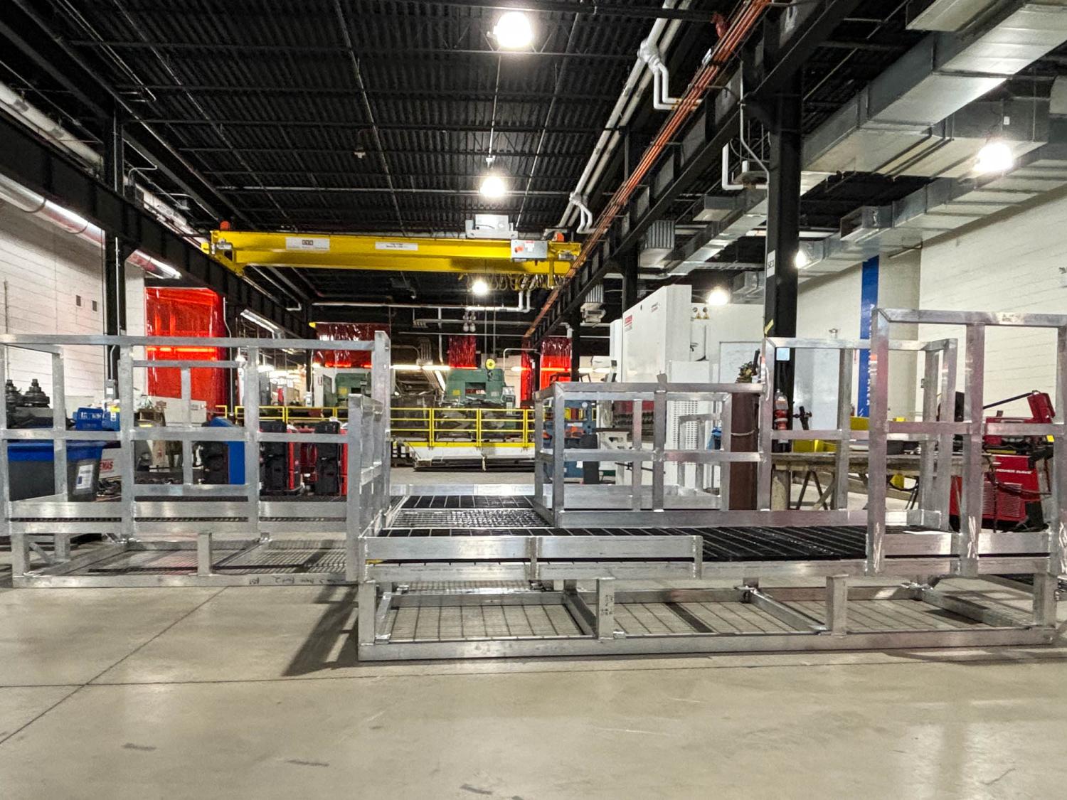 students manufacturing a platform out of aluminum bars