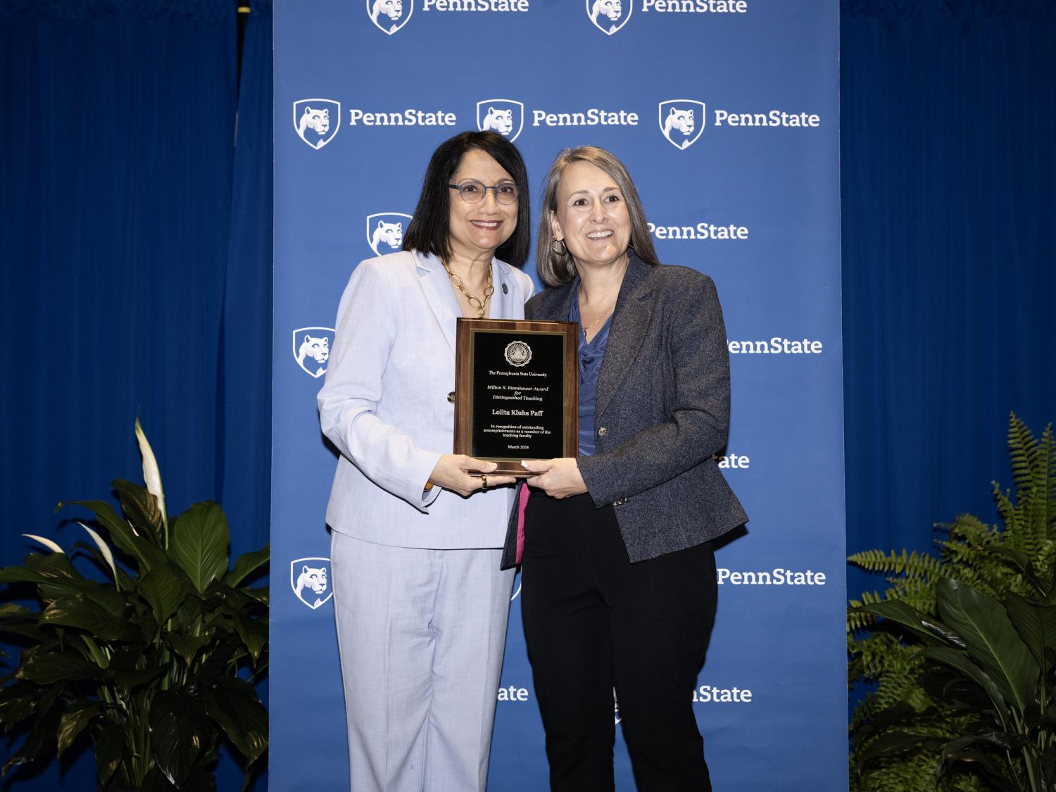 Lolita Paff poses with plaque and Neeli Bendapudi