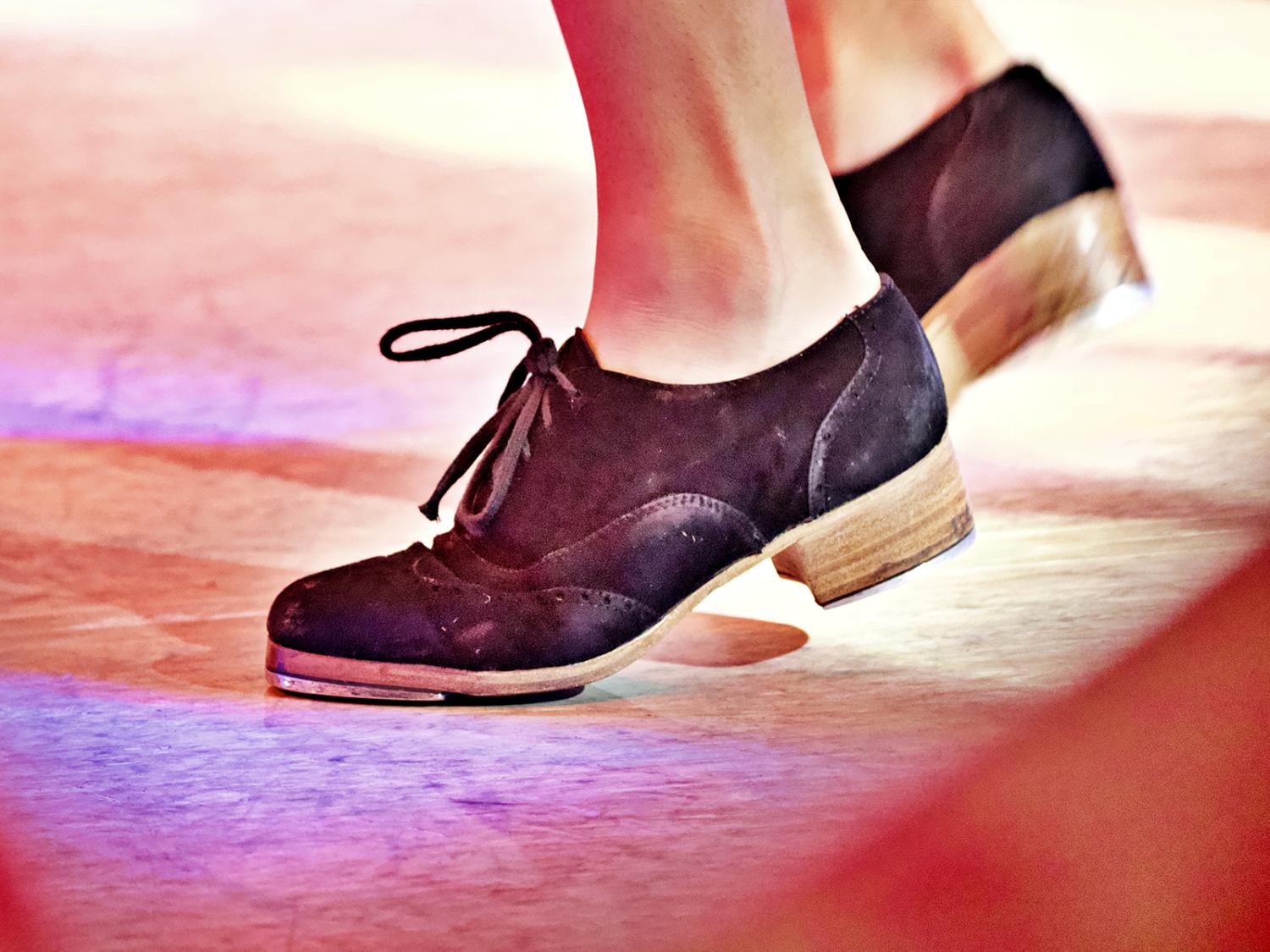 a close up of tap shoes dancing