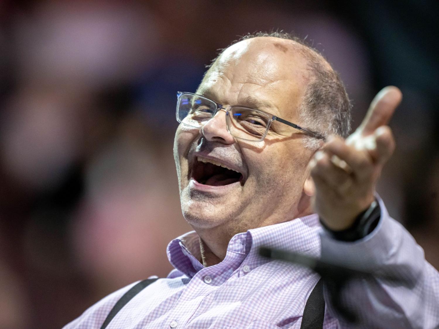 Gary Viebranz, teaching professor of music at Penn State Behrend, smiles while conducting the commencement band.