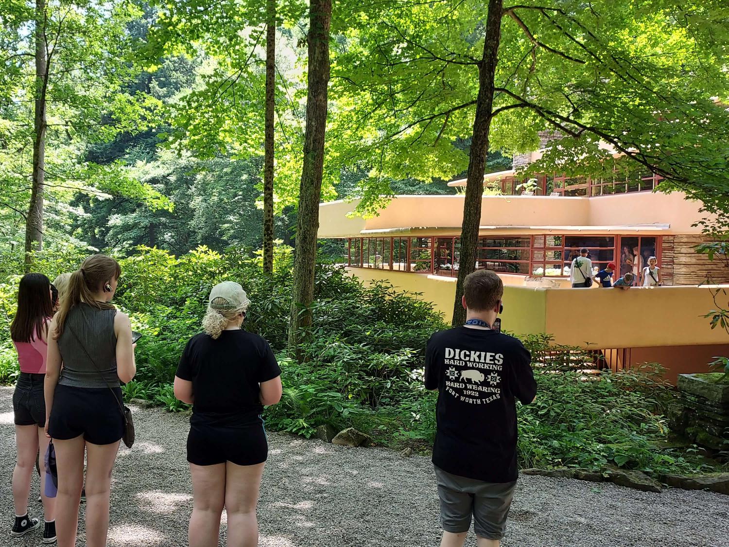 Students standing in front of Fallingwater house.
