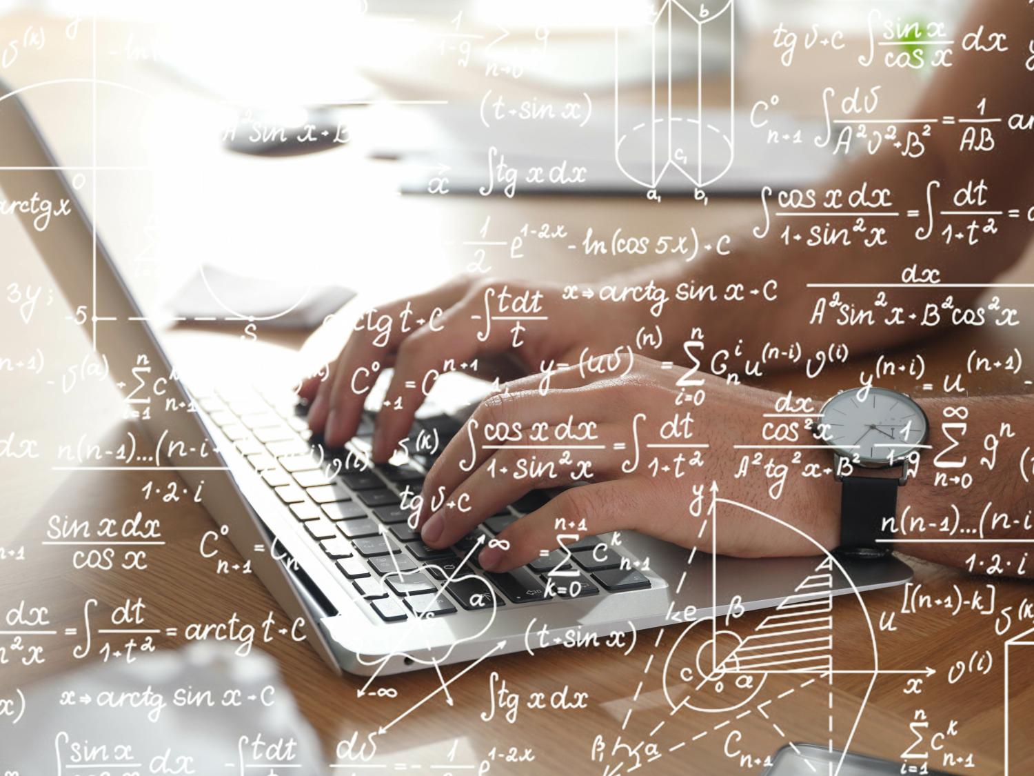 Human hands type on a laptop with mathematical equations written in the foreground.