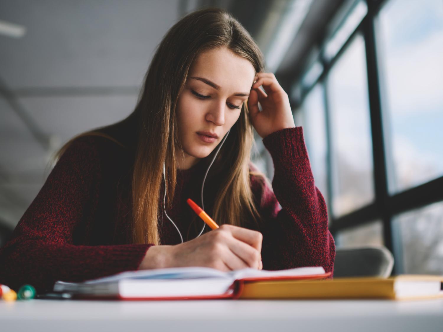 An adolescent girl studying.