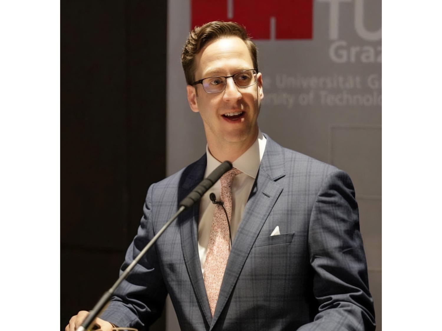 person standing at a microphone