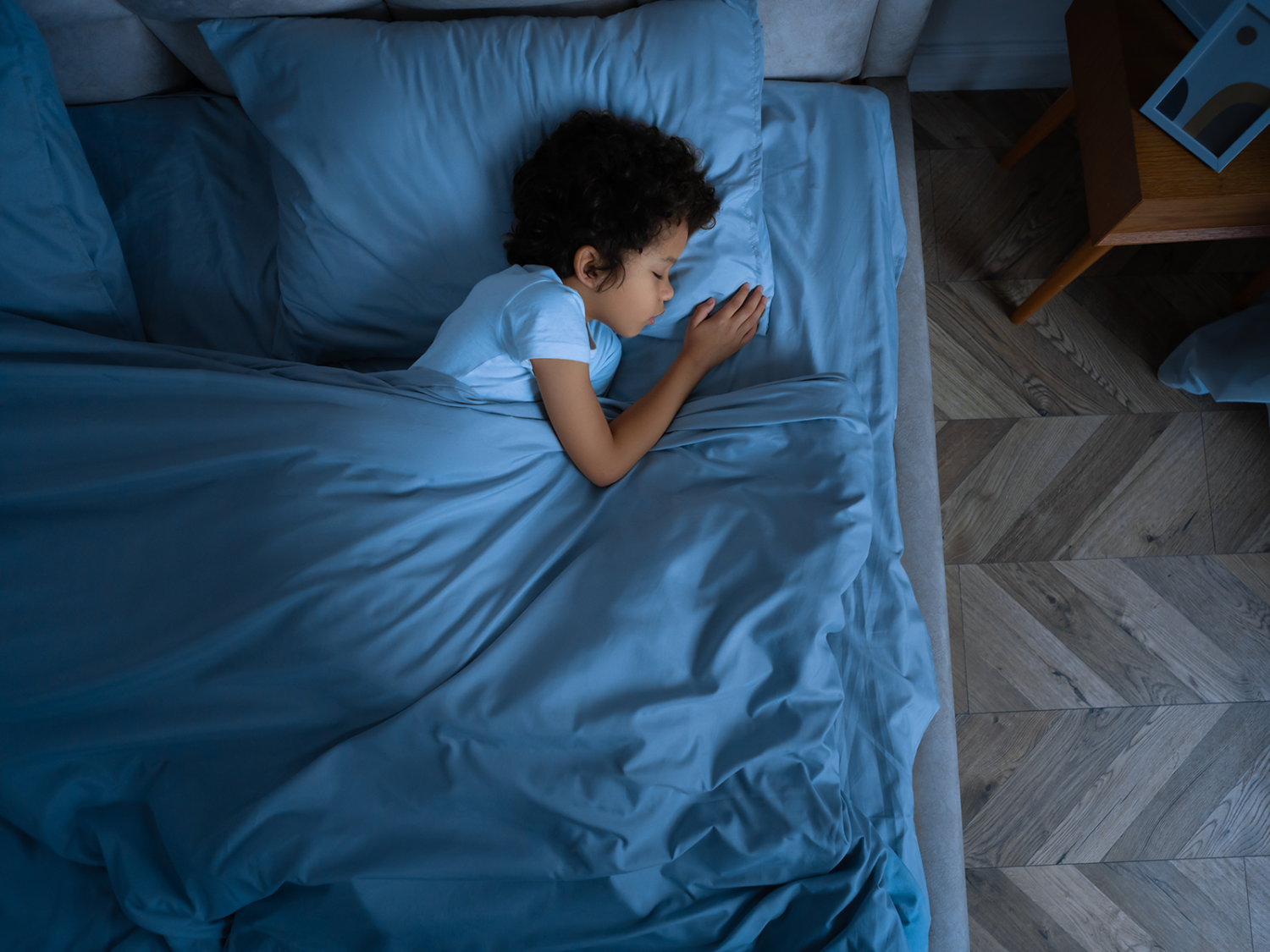 Child sleeping in bed