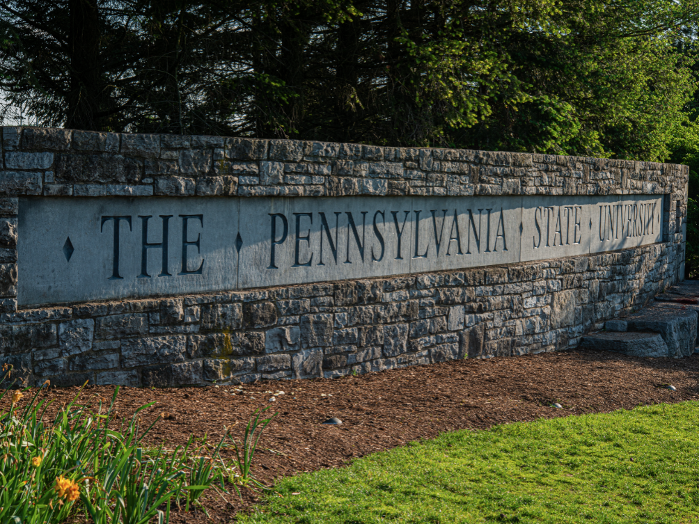 Stone wall with "THE PENNSYLVANIA STATE UNIVERSITY" written on it