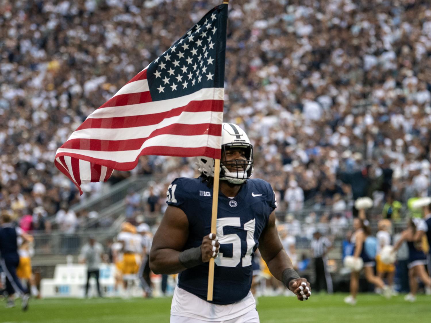 Hakeem Beamon leads team out with American Flag