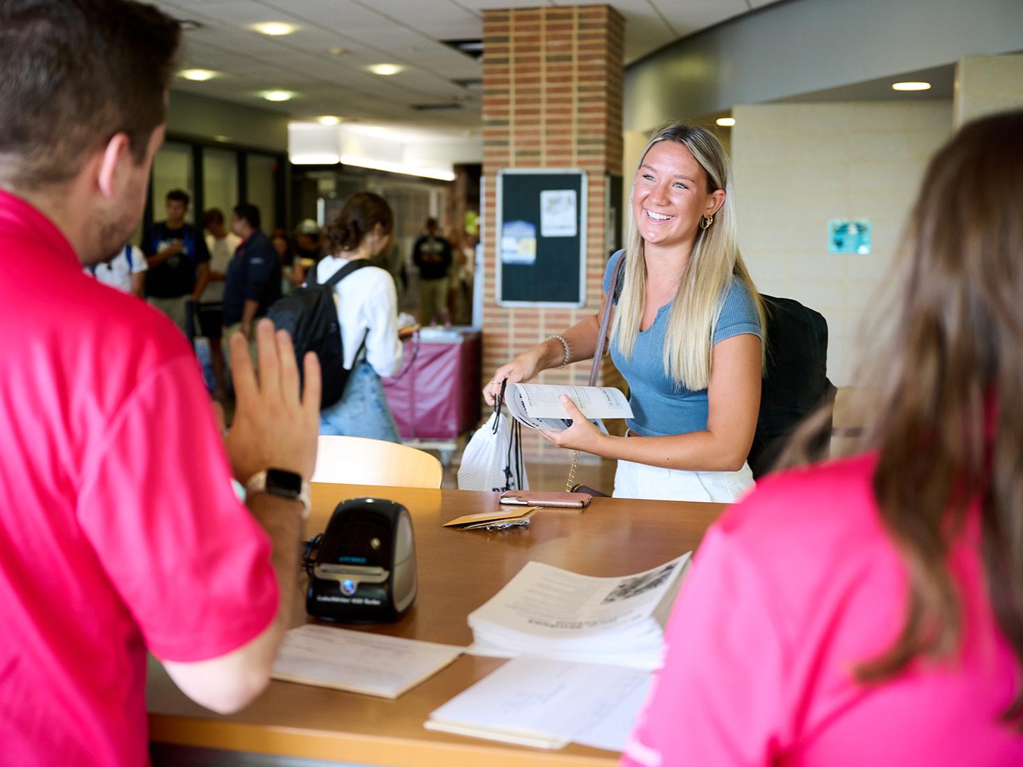 New Student Orientation leaders welcome a first-year student to orientation events.