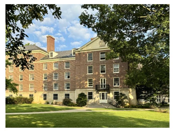 A brick building on a college campus