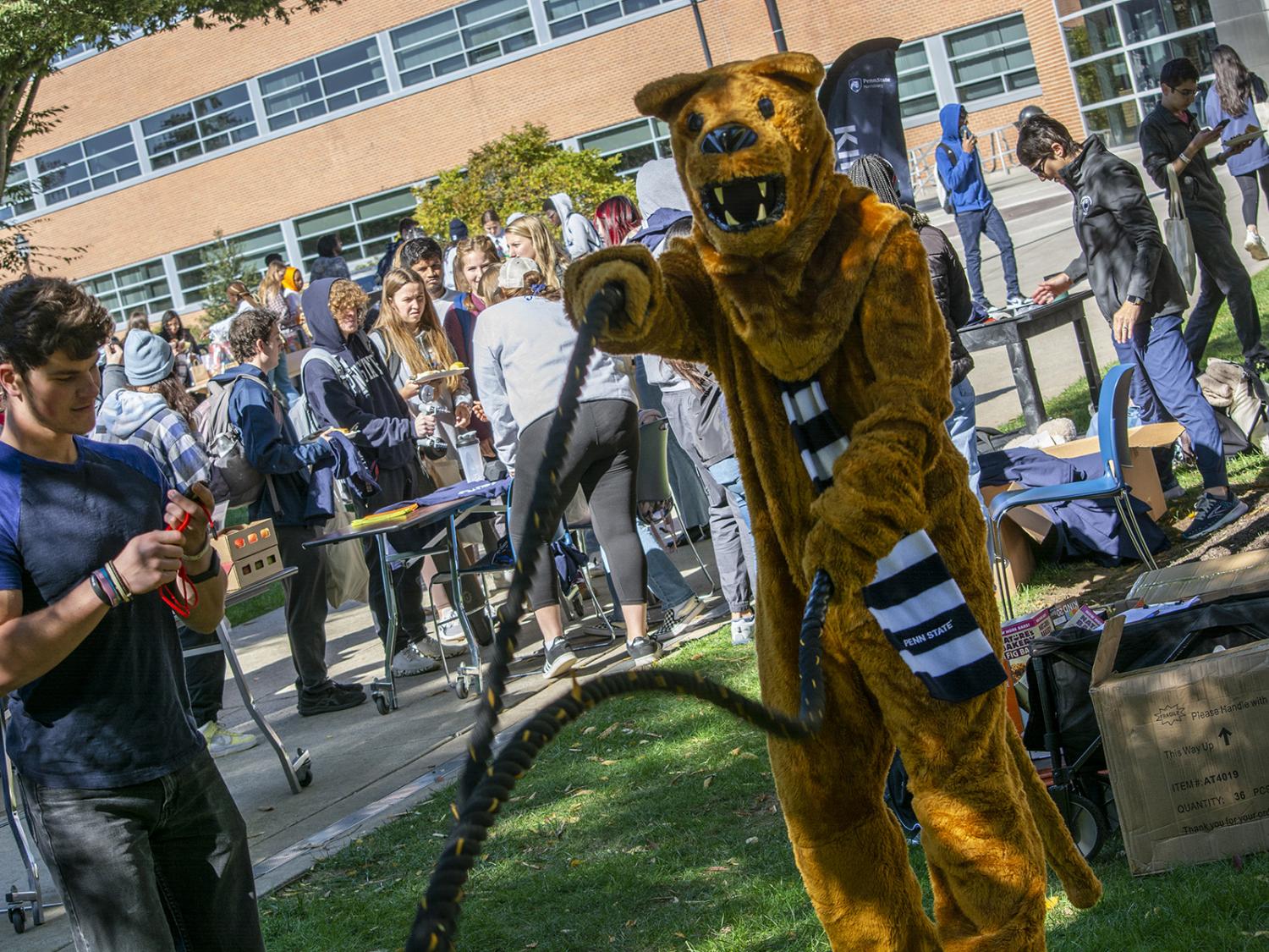 Nittany Lion uses ropes at a fitness station during Exercise is Medicine in 2022