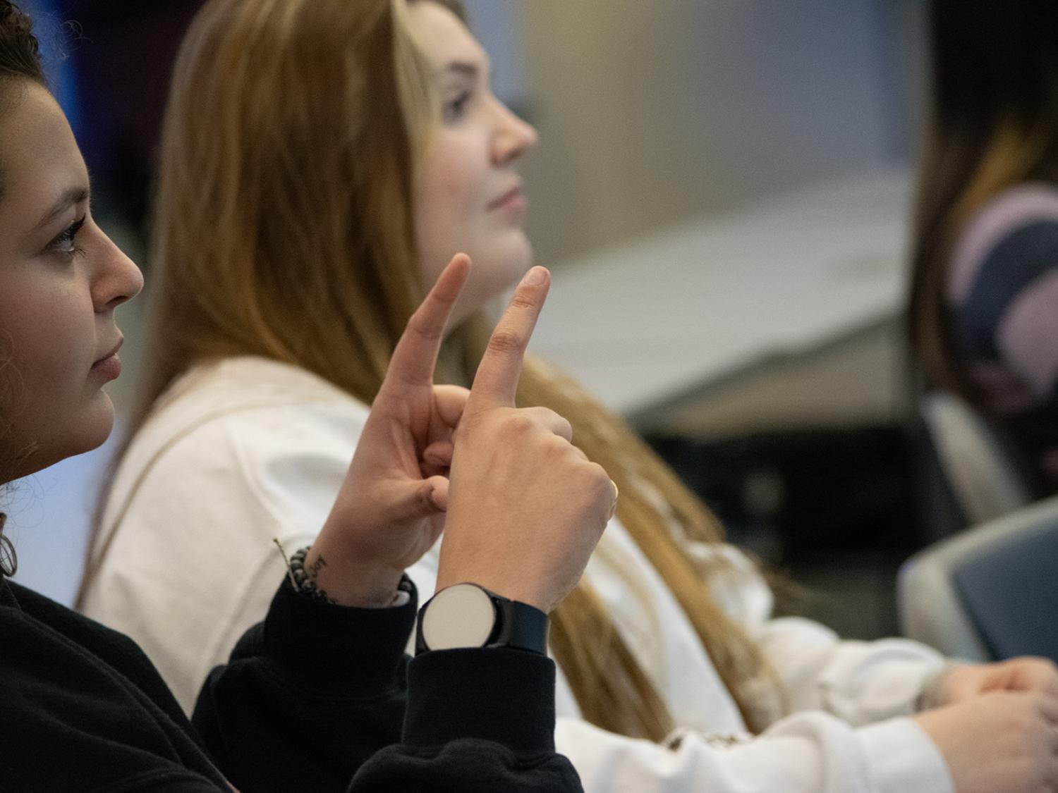 Students practice sign language in class
