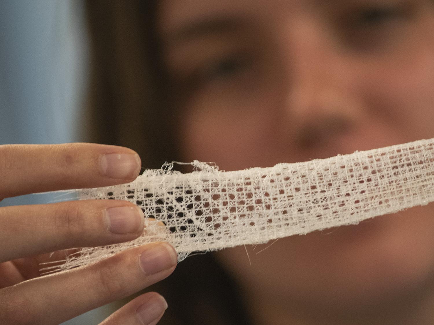 Olivia Lowe examining a sea sponge