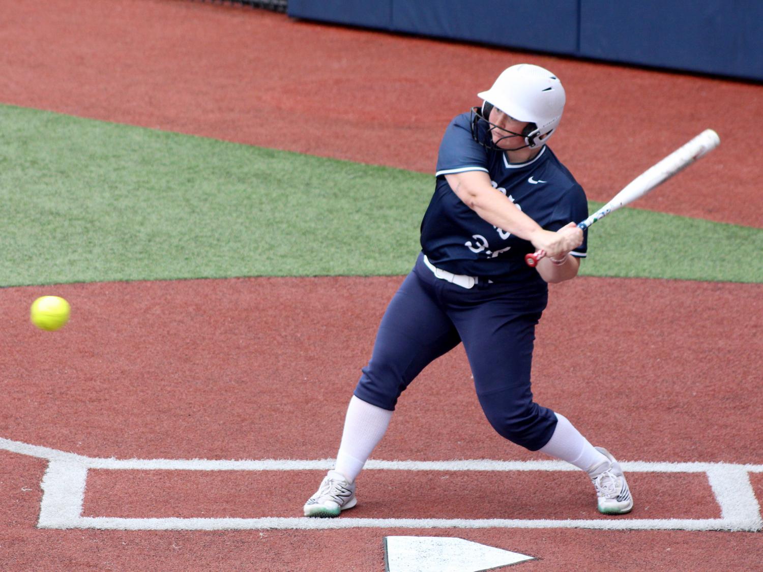 Penn State DuBois senior Chelsea Busatto starts her swing towards the ball during a recent home game at Heindl Field in DuBois.