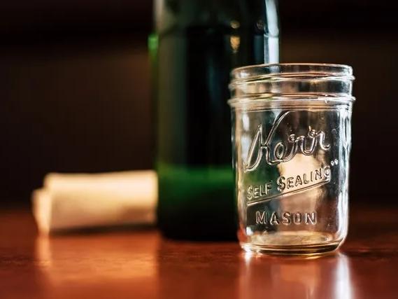 A canning jar on the table 